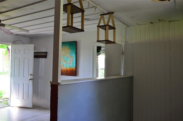 120 S Chickasaw Ave, Bartlesville, OK 74003 - entrance foyer with a ceiling fan, wooden walls, and wood finished floors