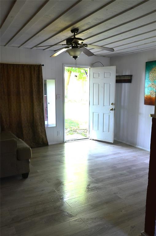 120 S Chickasaw Ave, Bartlesville, OK 74003 - entrance foyer featuring a ceiling fan, wood finished floors, and beamed ceiling