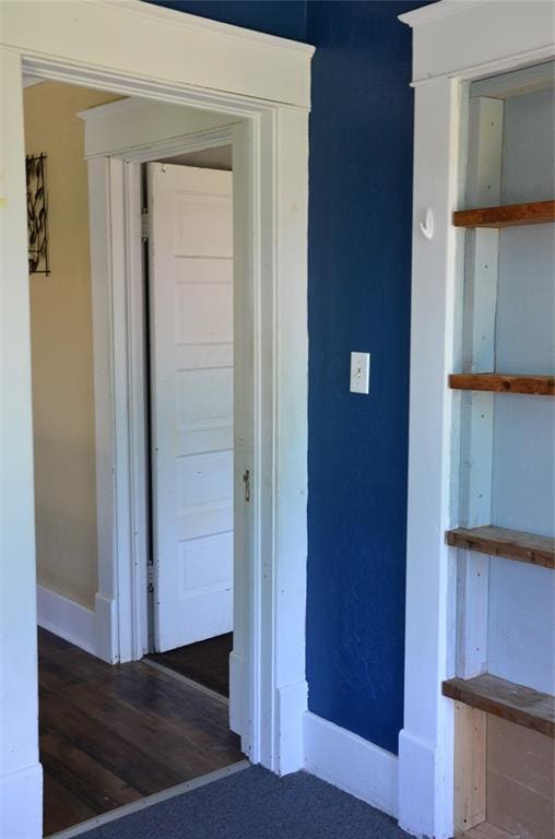 120 S Chickasaw Ave, Bartlesville, OK 74003 - hallway featuring baseboards and wood finished floors