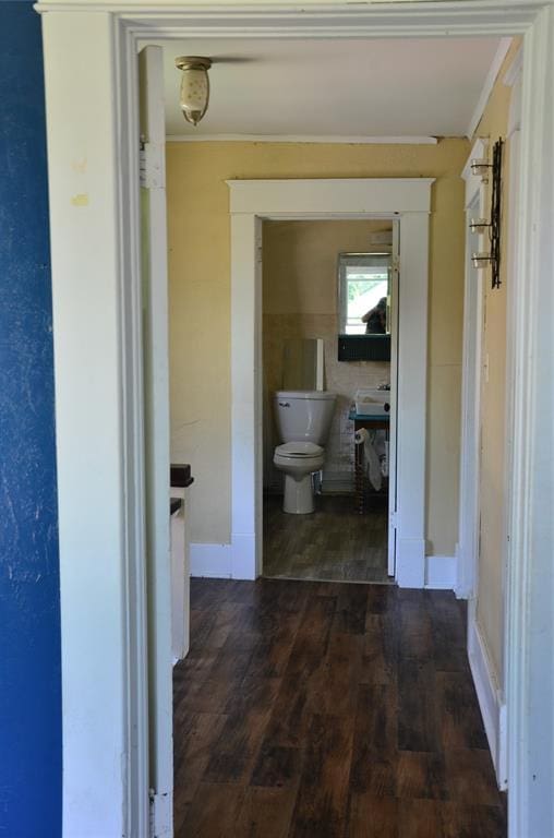 120 S Chickasaw Ave, Bartlesville, OK 74003 - corridor with crown molding and wood finished floors