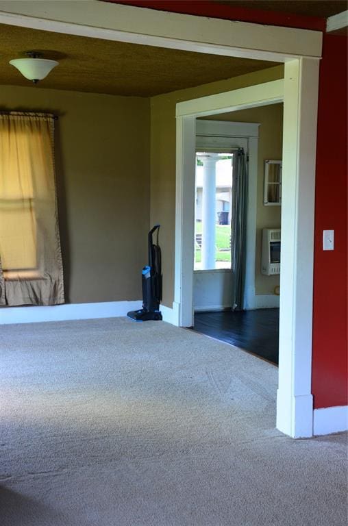 120 S Chickasaw Ave, Bartlesville, OK 74003 - carpeted spare room featuring heating unit and baseboards