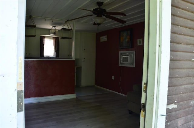 120 S Chickasaw Ave, Bartlesville, OK 74003 - unfurnished living room with wood finished floors, a wall mounted AC, and ceiling fan