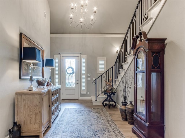 13308 NW 6th St, Yukon, OK 73099 - foyer entrance with a chandelier, stairway, and light wood-style flooring