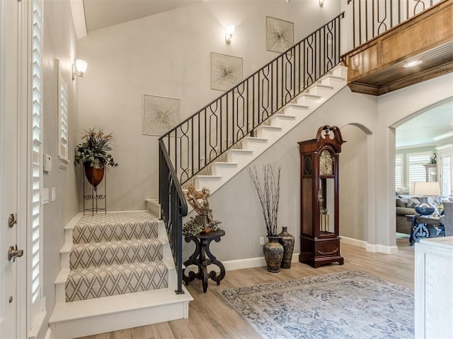 13308 NW 6th St, Yukon, OK 73099 - stairway with arched walkways and wood finished floors
