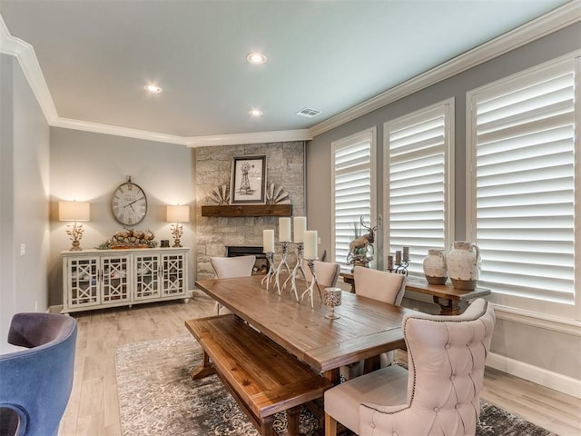 13308 NW 6th St, Yukon, OK 73099 - dining area featuring ornamental molding, a fireplace, light wood-style flooring, and recessed lighting