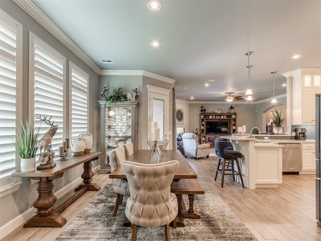13308 NW 6th St, Yukon, OK 73099 - dining space with light wood-style flooring, recessed lighting, ceiling fan, and ornamental molding