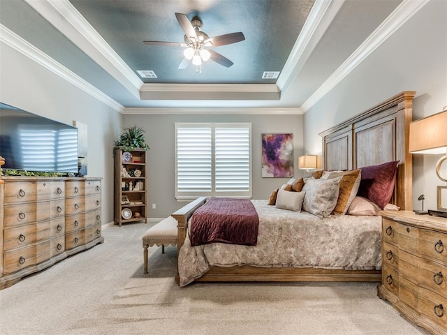13308 NW 6th St, Yukon, OK 73099 - bedroom with a tray ceiling, light carpet, crown molding, and a ceiling fan