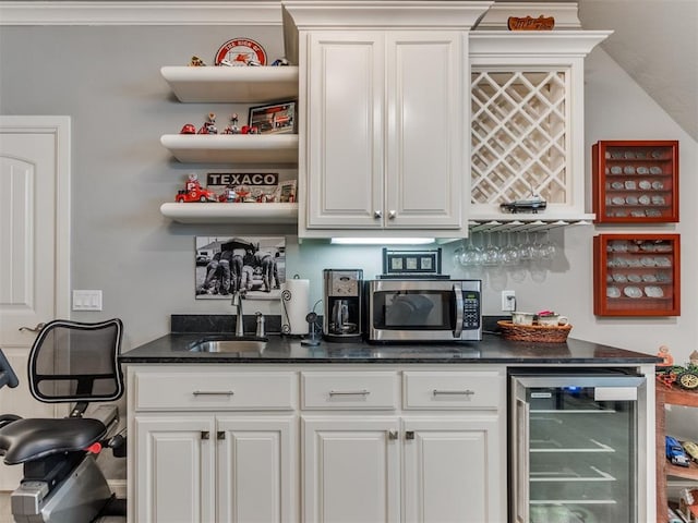 13308 NW 6th St, Yukon, OK 73099 - indoor dry bar featuring stainless steel microwave and beverage cooler