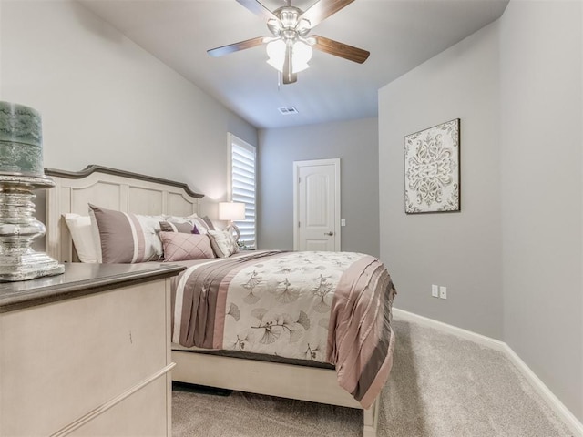 13308 NW 6th St, Yukon, OK 73099 - bedroom featuring light colored carpet and ceiling fan