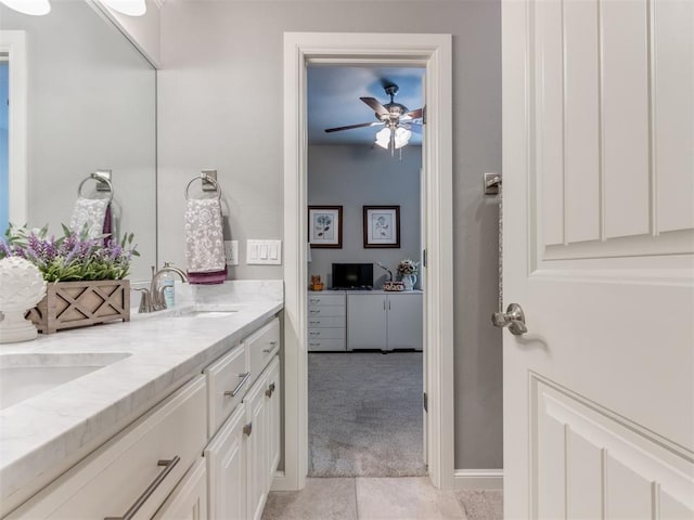 13308 NW 6th St, Yukon, OK 73099 - bathroom with double vanity, a ceiling fan, and tile patterned flooring
