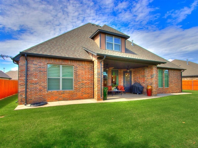 13308 NW 6th St, Yukon, OK 73099 - back of house with a fenced backyard, brick siding, a patio, and roof with shingles