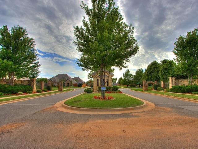 13308 NW 6th St, Yukon, OK 73099 - view of asphalt street featuring curbs