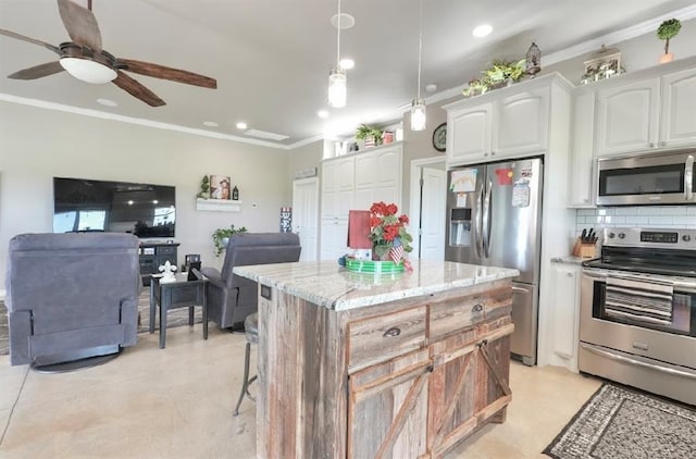 13902 Valley View Rd, Shawnee, OK 74804 - kitchen with stainless steel appliances, crown molding, white cabinetry, light stone counters, and tasteful backsplash