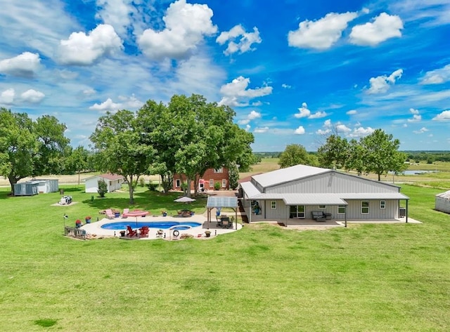 13902 Valley View Rd, Shawnee, OK 74804 - rear view of house featuring a patio area, an outdoor pool, a yard, and a shed