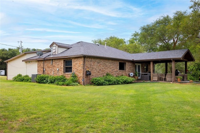 19277 E 1220th Rd, Sayre, OK 73662 - rear view of house featuring a lawn, brick siding, and a shingled roof