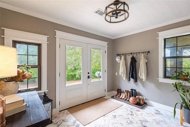 19277 E 1220th Rd, Sayre, OK 73662 - mudroom with french doors, crown molding, a chandelier, and brick patterned flooring