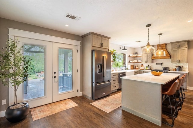 19277 E 1220th Rd, Sayre, OK 73662 - kitchen with appliances with stainless steel finishes, dark wood-style flooring, open shelves, healthy amount of natural light, and recessed lighting