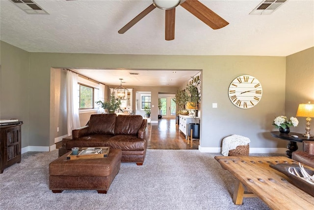 19277 E 1220th Rd, Sayre, OK 73662 - living room featuring carpet and ceiling fan