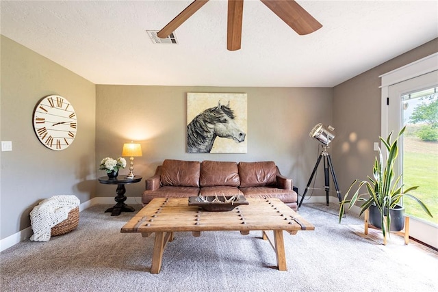 19277 E 1220th Rd, Sayre, OK 73662 - living area featuring carpet and ceiling fan