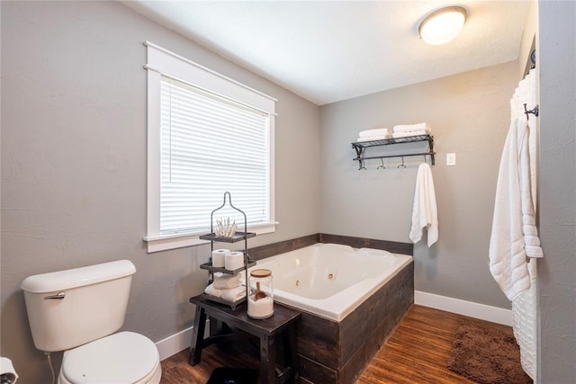 19277 E 1220th Rd, Sayre, OK 73662 - bathroom with wood finished floors and a tub with jets