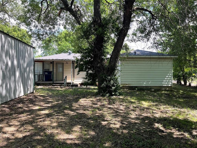 1333 Reid St, Seminole, OK 74868 - rear view of house featuring a metal roof