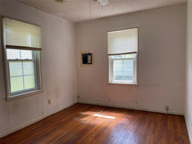 1333 Reid St, Seminole, OK 74868 - spare room featuring hardwood / wood-style flooring and a smoke detector
