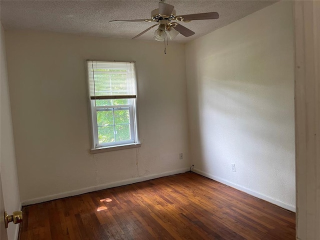 1333 Reid St, Seminole, OK 74868 - spare room featuring hardwood / wood-style floors, a ceiling fan, and a textured ceiling