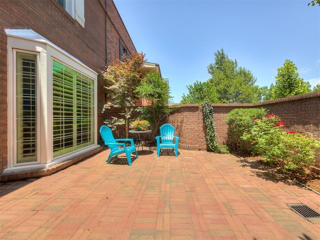 6432 Brandywine Ln, Oklahoma City, OK 73116 - fenced backyard featuring a patio area