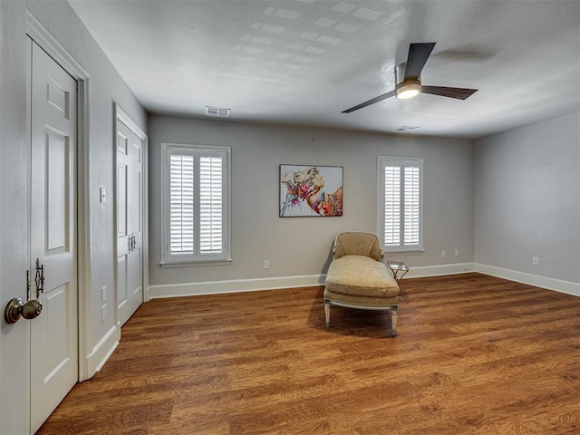 6432 Brandywine Ln, Oklahoma City, OK 73116 - living area with healthy amount of natural light, wood finished floors, and a ceiling fan
