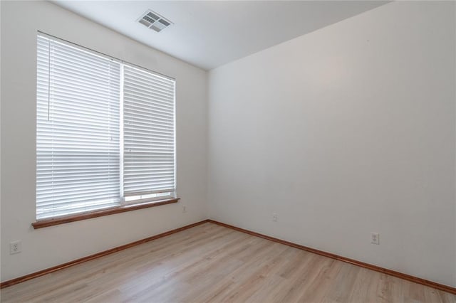 2412 NW 164th Ter, Edmond, OK 73013 - unfurnished room with wood finished floors and baseboards