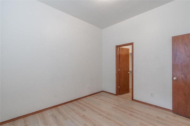 2412 NW 164th Ter, Edmond, OK 73013 - empty room featuring light wood-type flooring and baseboards