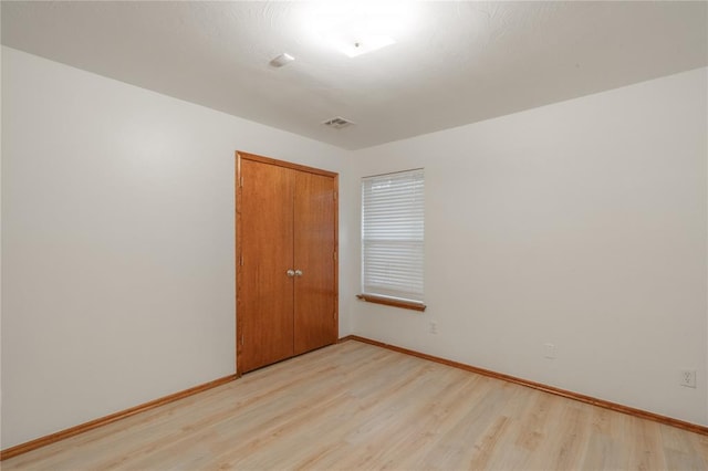 2412 NW 164th Ter, Edmond, OK 73013 - empty room featuring light wood-type flooring and baseboards