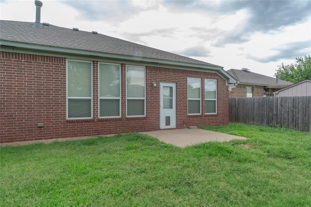 2412 NW 164th Ter, Edmond, OK 73013 - rear view of property with brick siding, a patio area, and a shingled roof
