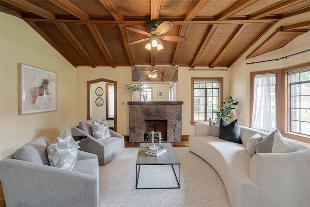 217 NW 30th St, Oklahoma City, OK 73118 - living area featuring wood ceiling, a stone fireplace, healthy amount of natural light, and a ceiling fan