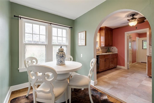 217 NW 30th St, Oklahoma City, OK 73118 - dining area featuring arched walkways and ceiling fan