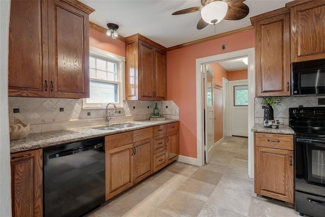 217 NW 30th St, Oklahoma City, OK 73118 - kitchen with black appliances, tasteful backsplash, plenty of natural light, and crown molding