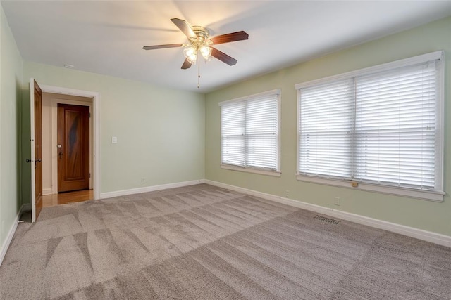 217 NW 30th St, Oklahoma City, OK 73118 - spare room featuring a ceiling fan and carpet floors