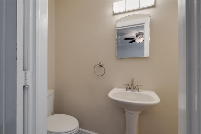 217 NW 30th St, Oklahoma City, OK 73118 - bathroom featuring toilet and baseboards