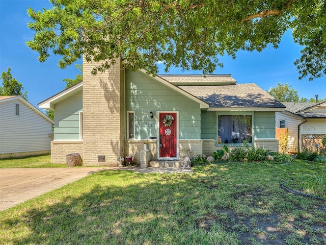 4603 N Wheeler Ave, Bethany, OK 73008 - view of front of home featuring a front lawn, a chimney, brick siding, and roof with shingles