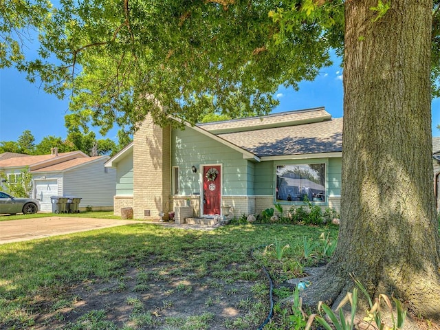 4603 N Wheeler Ave, Bethany, OK 73008 - view of front of house featuring brick siding, a chimney, a front yard, and a shingled roof