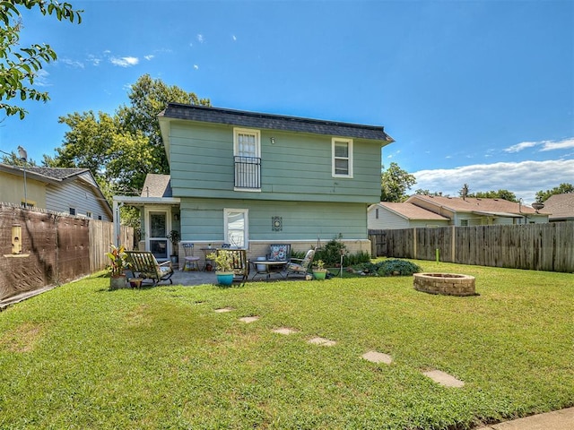 4603 N Wheeler Ave, Bethany, OK 73008 - rear view of property with a fire pit and a fenced backyard