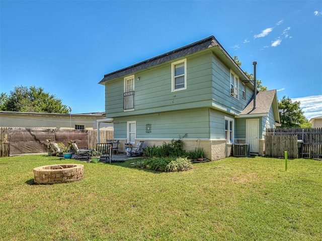 4603 N Wheeler Ave, Bethany, OK 73008 - rear view of property with a fire pit