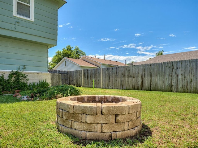4603 N Wheeler Ave, Bethany, OK 73008 - fenced backyard with an outdoor fire pit