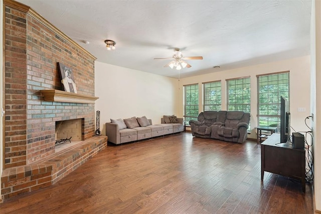 14601 Billy Dr, Edmond, OK 73034 - living area featuring a ceiling fan, wood finished floors, and a brick fireplace