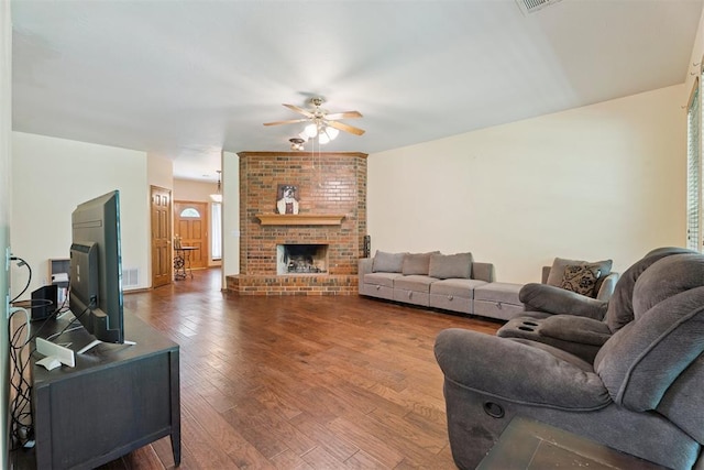 14601 Billy Dr, Edmond, OK 73034 - living room featuring a ceiling fan, hardwood / wood-style flooring, and a brick fireplace