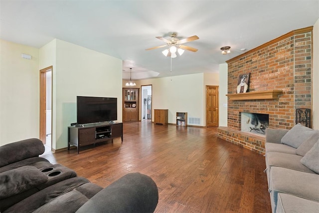 14601 Billy Dr, Edmond, OK 73034 - living room with wood-type flooring, ceiling fan, and a brick fireplace