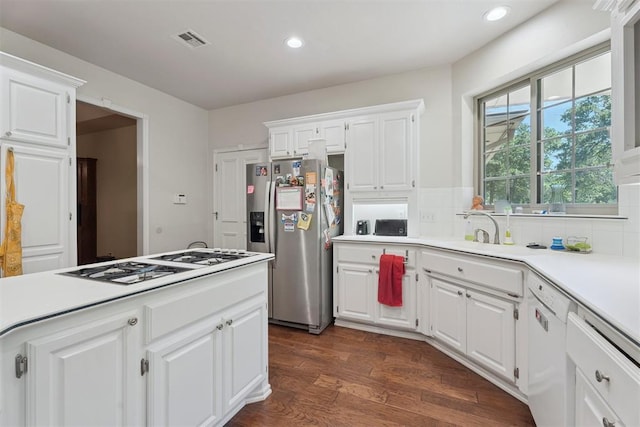 14601 Billy Dr, Edmond, OK 73034 - kitchen with white appliances, light countertops, recessed lighting, white cabinetry, and backsplash