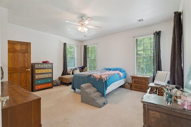 14601 Billy Dr, Edmond, OK 73034 - bedroom featuring light colored carpet and a ceiling fan
