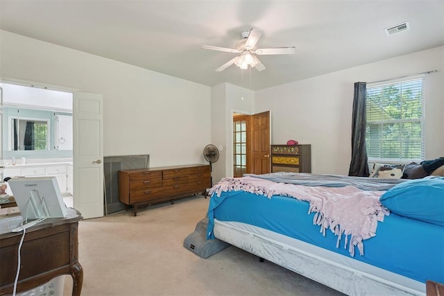14601 Billy Dr, Edmond, OK 73034 - carpeted bedroom with ceiling fan and connected bathroom