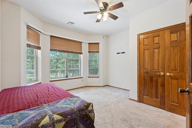 14601 Billy Dr, Edmond, OK 73034 - bedroom featuring carpet and a ceiling fan